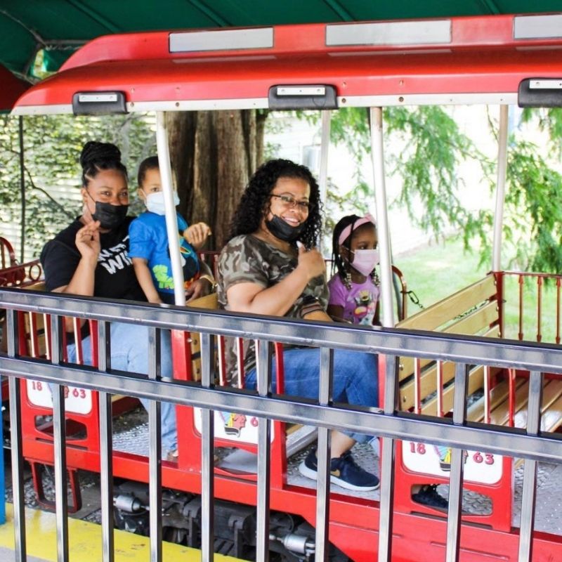 The Harrison family riding the Wonderland Special at Dutch Wonderland