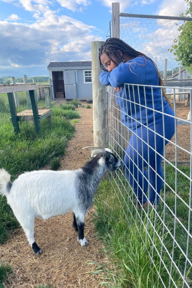 Tiffany with goat at Fassit Mansion