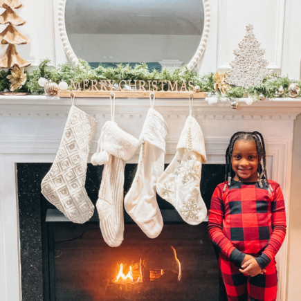 Annalise standing in front of my Christmas Mantel