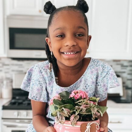 Annalise holding a flower pot