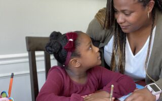 Tiffany helping Annalise with her homework