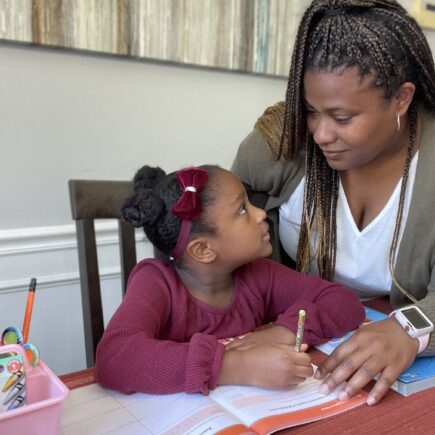 Tiffany helping Annalise with her homework