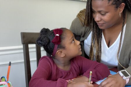 Tiffany helping Annalise with her homework