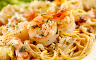 Lemon garlic butter shrimp over pasta is a quick and healthy weeknight dinner idea