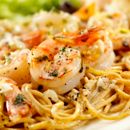 Lemon garlic butter shrimp over pasta is a quick and healthy weeknight dinner idea