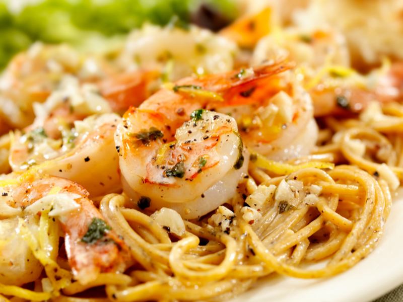 Lemon garlic butter shrimp over pasta is a quick and healthy weeknight dinner idea